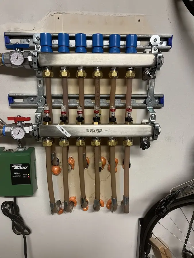 Plumber performing Water Heater Repair at a residential property in Harvard